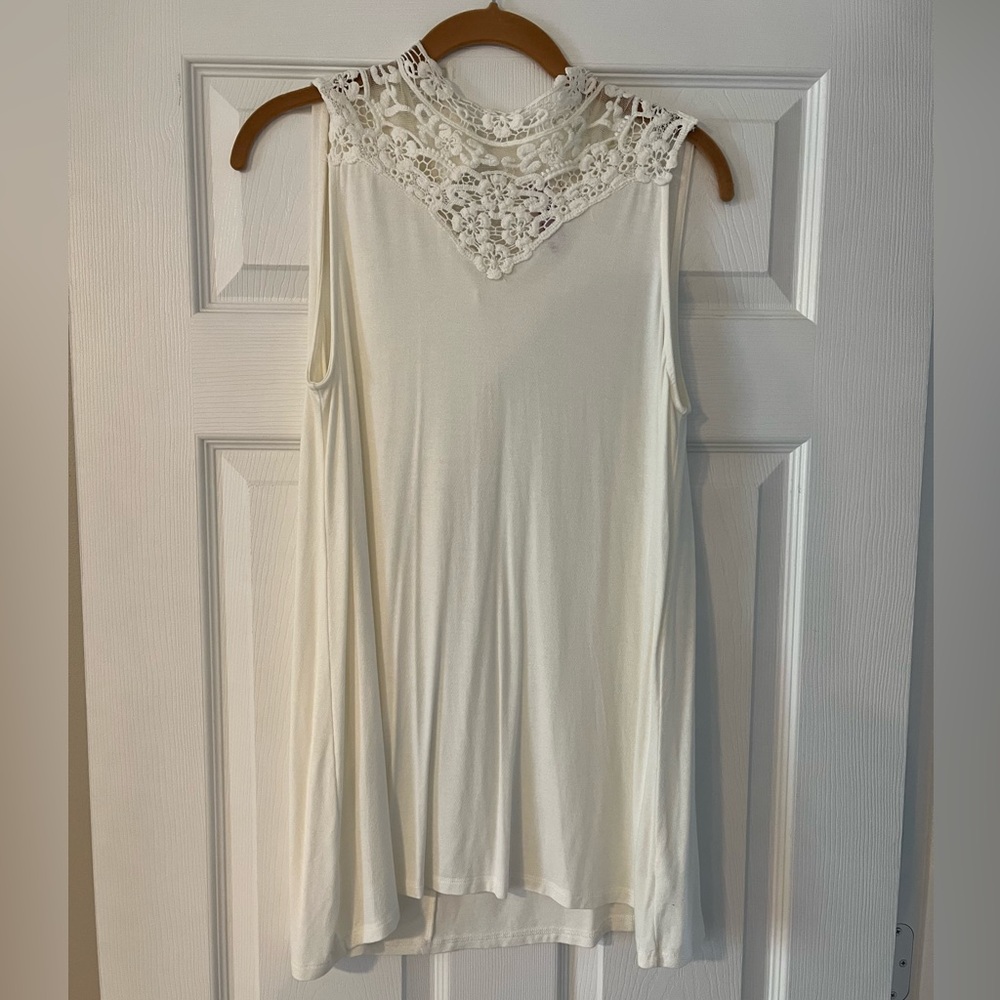 White, sleeveless top, buttons on the back, crochet/see through details